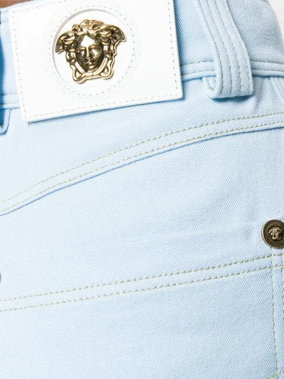 Shop Versace Tapered Jeans In A8432-light Blue