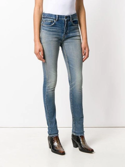 Shop Saint Laurent Faded Skinny Jeans In Blue