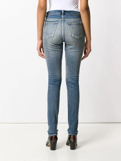 Shop Saint Laurent Faded Skinny Jeans In Blue