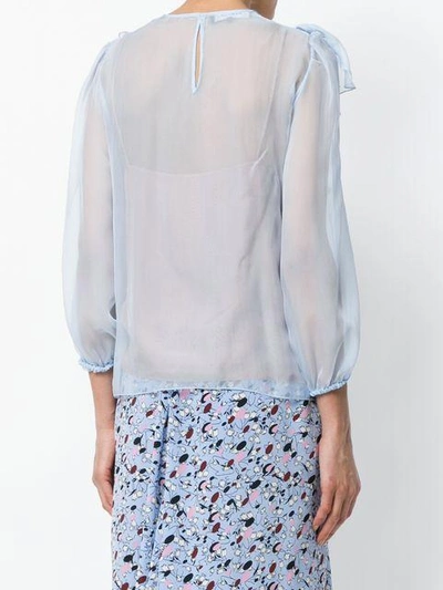 ruffled blouse