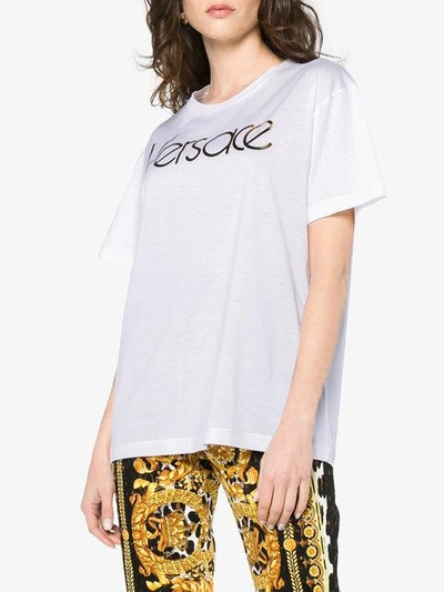 Shop Versace Metallic Logo Print Short Sleeve T Shirt In White