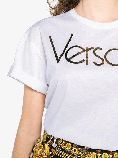 Shop Versace Metallic Logo Print Short Sleeve T Shirt In White