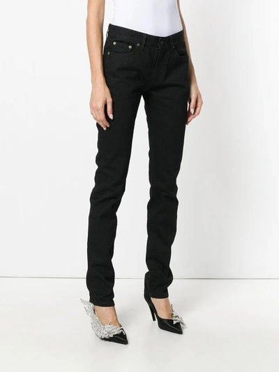 Shop Saint Laurent Mid Rise Skinny Jeans In Black