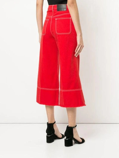 Shop Msgm Cropped Flare Jeans - Red