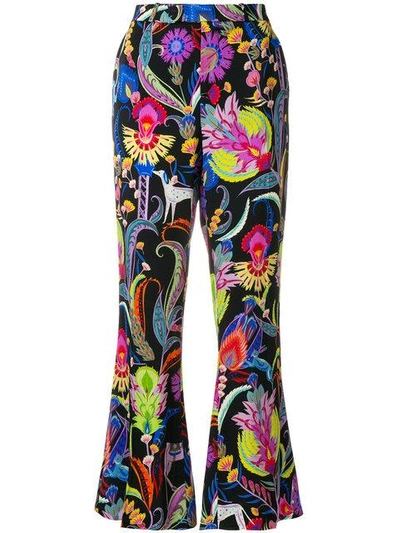 Shop Etro Mixed Floral Print Flared Trousers - Multicolour