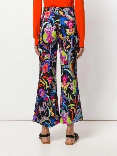 Shop Etro Mixed Floral Print Flared Trousers - Multicolour