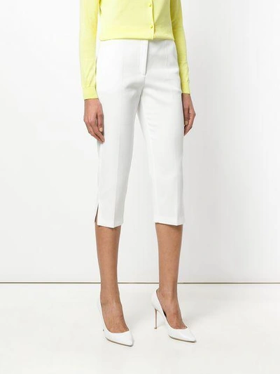 Shop Boutique Moschino Cropped Trousers In White