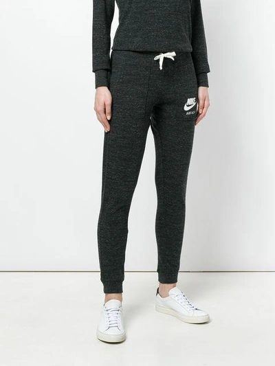 Shop Nike Logo Print Track Pants - Grey