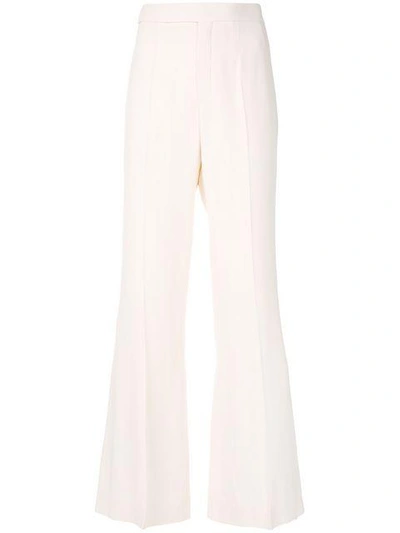 Shop Chloé High-rise Flared Trousers - Nude & Neutrals