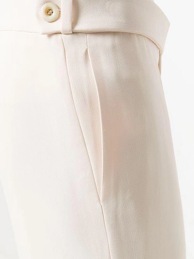 Shop Chloé High-rise Flared Trousers - Nude & Neutrals