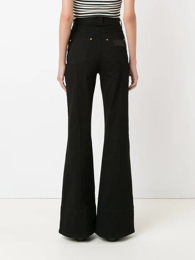 Shop Amapô High Waist Flared Jeans In Black