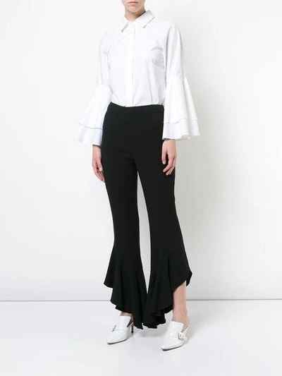 Shop Josie Natori Flared Ruffle Trousers In Black Blk