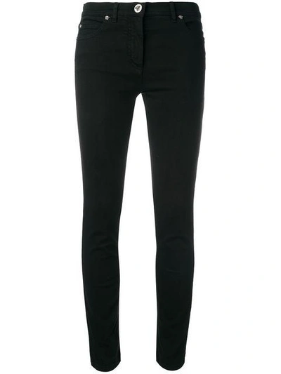 Shop Versace Skinny Jeans In Black