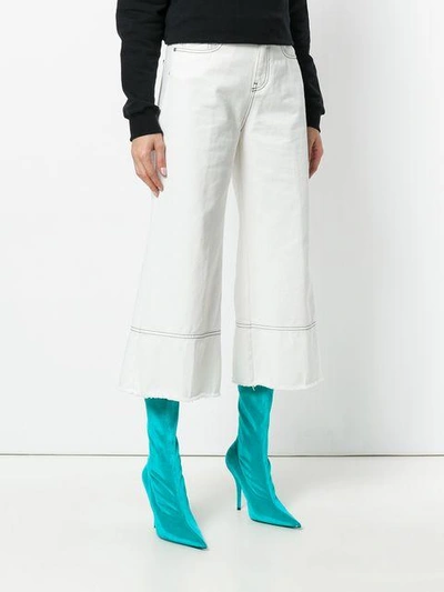 Shop Msgm Cropped Flare Jeans In White