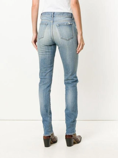 Shop Saint Laurent Distressed Skinny Jeans In Blue