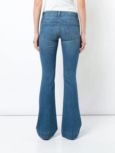 Shop J Brand Flared Jeans In Blue