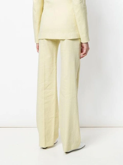 Shop Joseph Flared High-waisted Trousers In Yellow