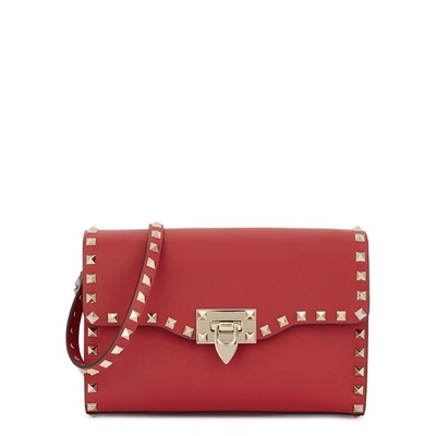 Shop Valentino Rockstud Leather Cross-body Bag In Red
