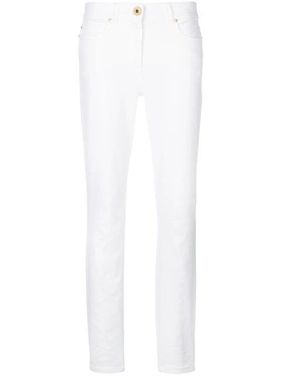 Shop Versace Slim Fit Jeans - White