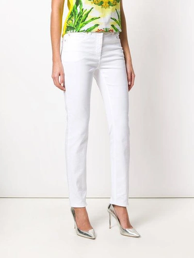Shop Versace Slim Fit Jeans - White