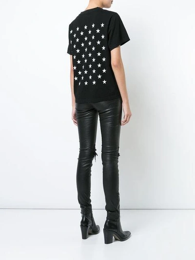 Shop Amiri Celebrate Star-print T-shirt - Black