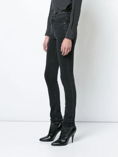 Shop Saint Laurent Faded Skinny Jeans In Black