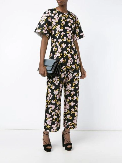 Shop Marni Floral Print Trousers In Black