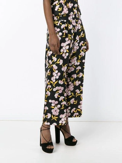 Shop Marni Floral Print Trousers In Black