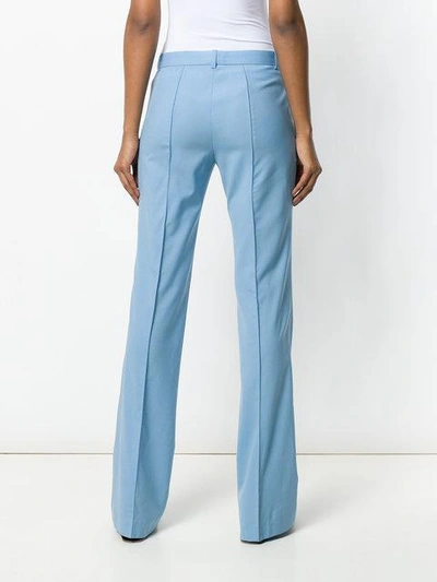 Shop Versace Flared Tailored Trousers