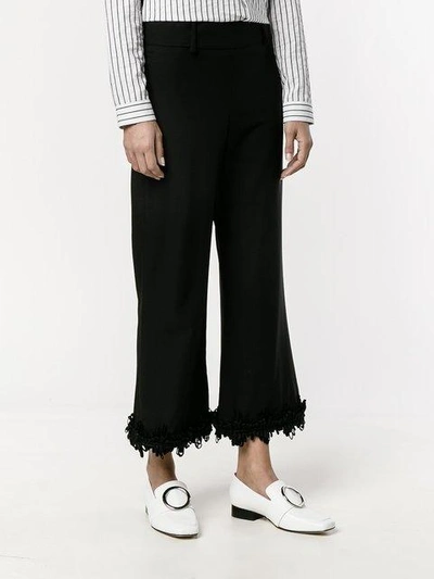 Shop Creatures Of The Wind Fringed Flared Trousers In Black