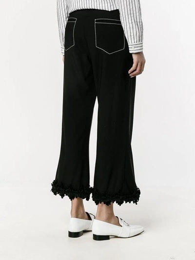 Shop Creatures Of The Wind Fringed Flared Trousers In Black