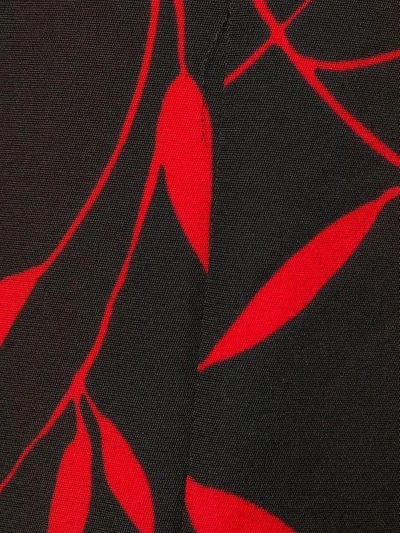 Shop Diane Von Furstenberg Leaf Print Flared Trousers In Black