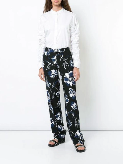 Shop Michael Kors Floral Print Trousers In Black