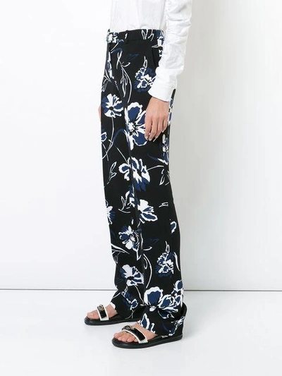 Shop Michael Kors Floral Print Trousers In Black