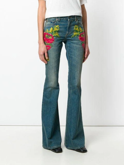 Shop Gucci Embellished Flared Jeans - Blue