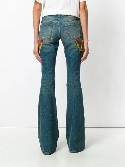 Shop Gucci Embellished Flared Jeans - Blue