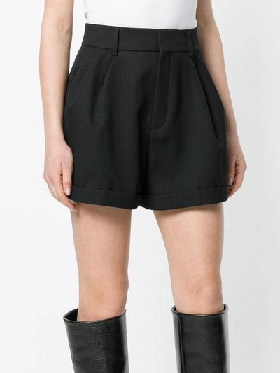 Shop Saint Laurent Flared Design Shorts In Black
