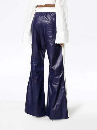 Shop Off-white High Waisted Flared Leather Track Pants - Blue