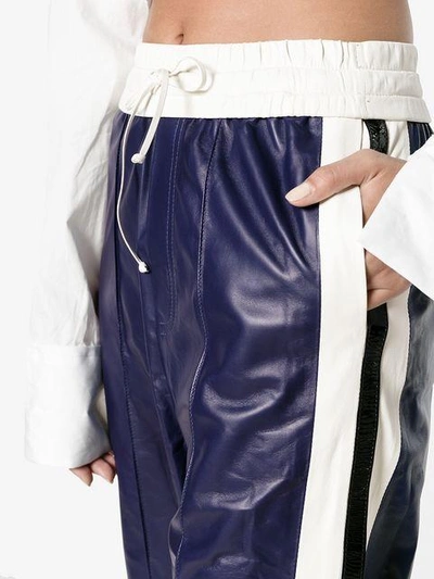 Shop Off-white High Waisted Flared Leather Track Pants - Blue