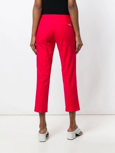 Shop Michael Michael Kors Cropped Tailored Trousers In Red