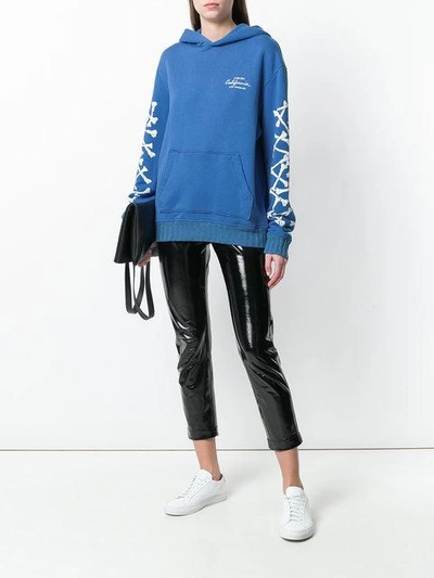 Shop Amiri Bones Oversized Hoodie - Blue