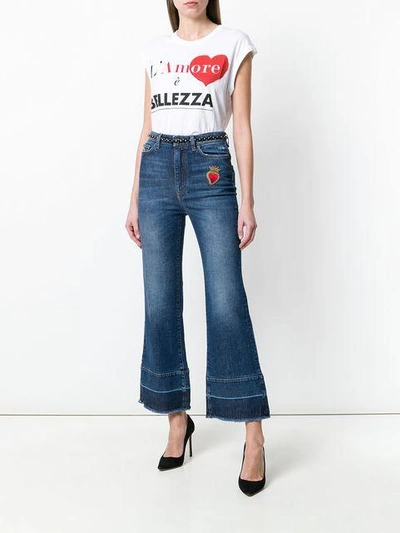 Shop Dolce & Gabbana Flared Jeans With Sacred Heart Appliqué In Blue