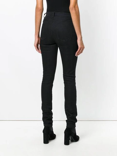 Shop Saint Laurent Mid Waist Tight Slim Fit Jeans In Black