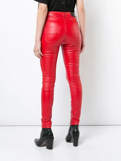 Shop Amiri Lx1 Skinny Leather Trousers In Red