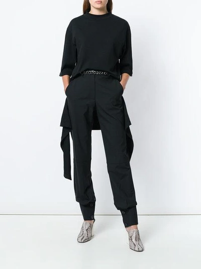 Shop Jw Anderson Button Cuff Trousers In Black