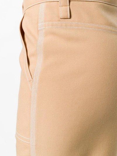 Shop Chloé Cropped Stitch Detail Trousers In Brown