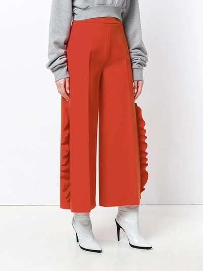 Shop Msgm Wide-leg Ruffle Trousers In Yellow