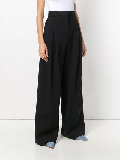 Shop Jw Anderson Wide Leg Trousers In Black