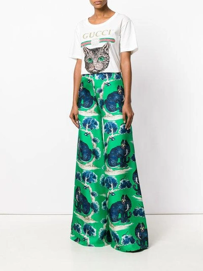 Shop Gucci Cat Print Flared Trousers - Green