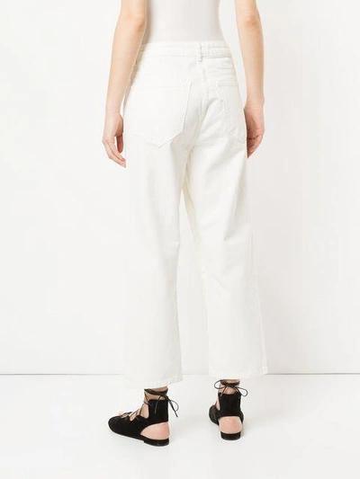 Shop Aalto Cropped Flared Jeans In White